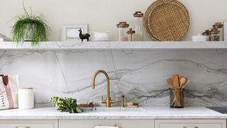 marble kitchen splashback and brass kitchen tap