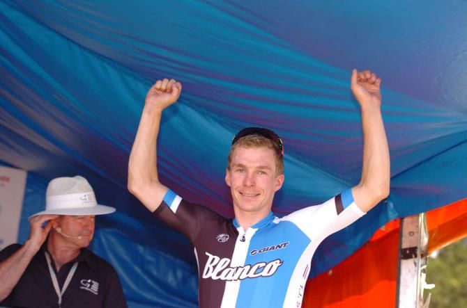 Tom-Jelte Slagter (Blanco) steps onto the stage after claiming his first professional victory