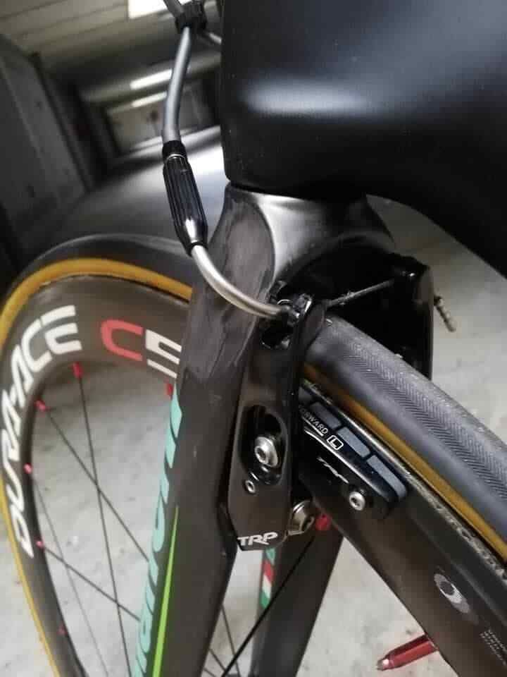 The front brake is tucked away behind the forks to keep things as aerodynamic as possible