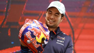  Sergio Perez of Mexico and Oracle Red Bull Racing shows the helmet he will use at the 2024 Mexico City Grand Prix during a press conference at Plaza Carso on October 23, 2024 in Mexico City, Mexico.