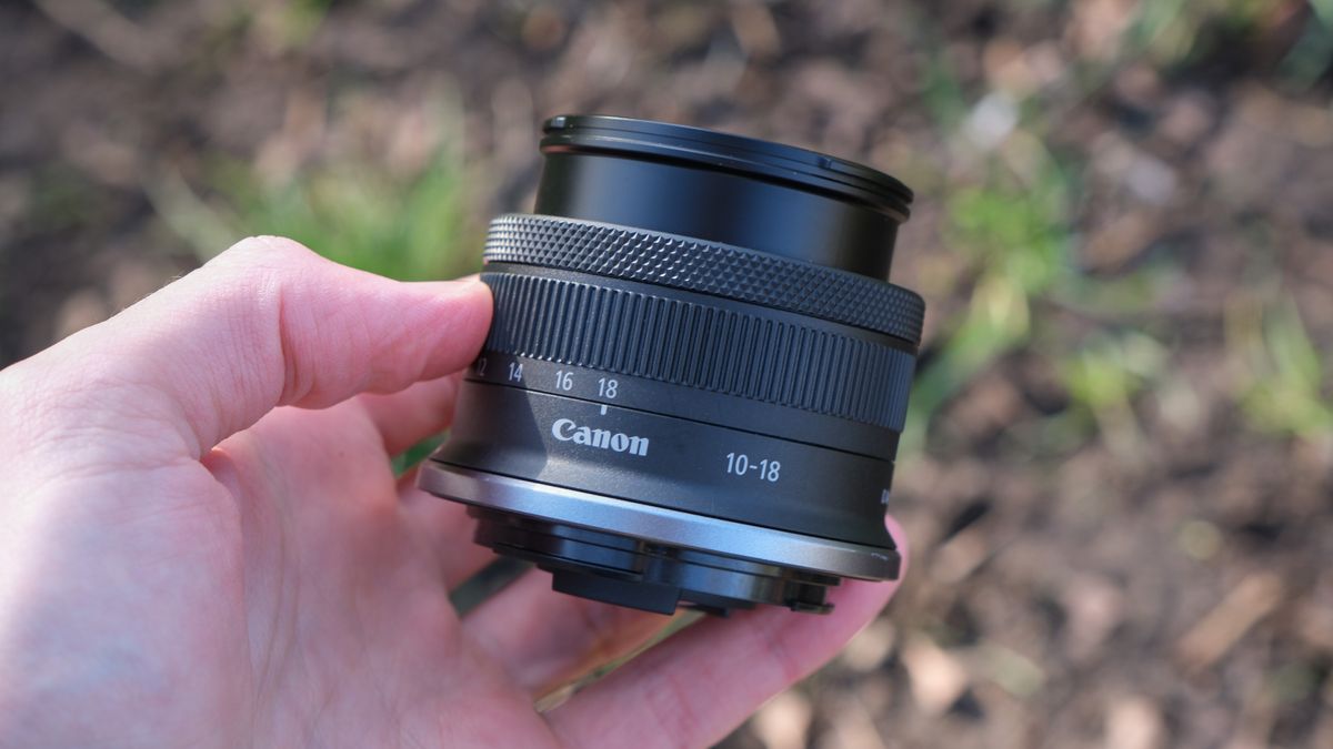 Canon RF-S 10-18mm lens held in a hand