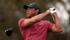 Tiger Woods watches his tee shot