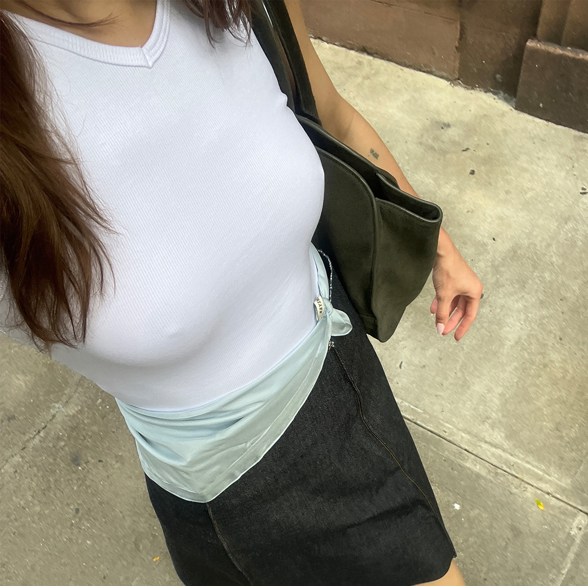 Eliza Huber wearing a Zara stretch ribbed tank top with a Kallmeyer blue scarf, gray COS bag, and denim Tory Burch skirt. 