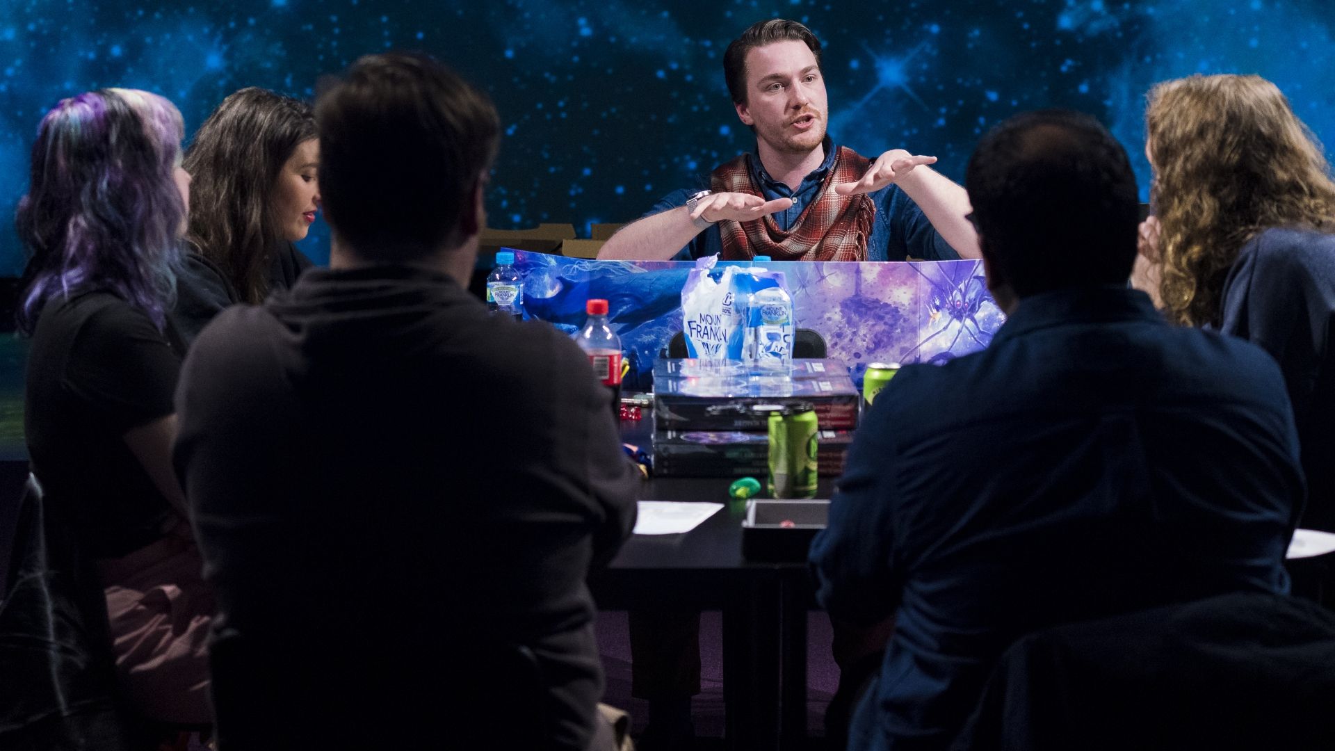 Dungeons & Dragons players pay rapt attention to their Dungeon Master
