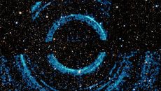 Concentric ripples in galactic dust clouds triggered by a black-hole burst.