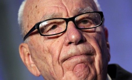 Rupert Murdoch resignation from several News Corp. boards raises fresh speculation that he may be planning an eventual sale of his major newspapers.