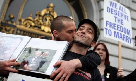 People celebrate in San Francisco Tuesday after a gay-marriage ban is overturned, although the federal appellate ruling may be too narrow to have an effect on any state other than California.