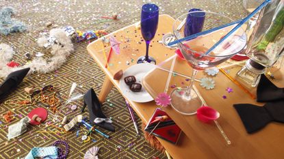 Champagne glasses, noisemakers and other celebratory debris after a big party.