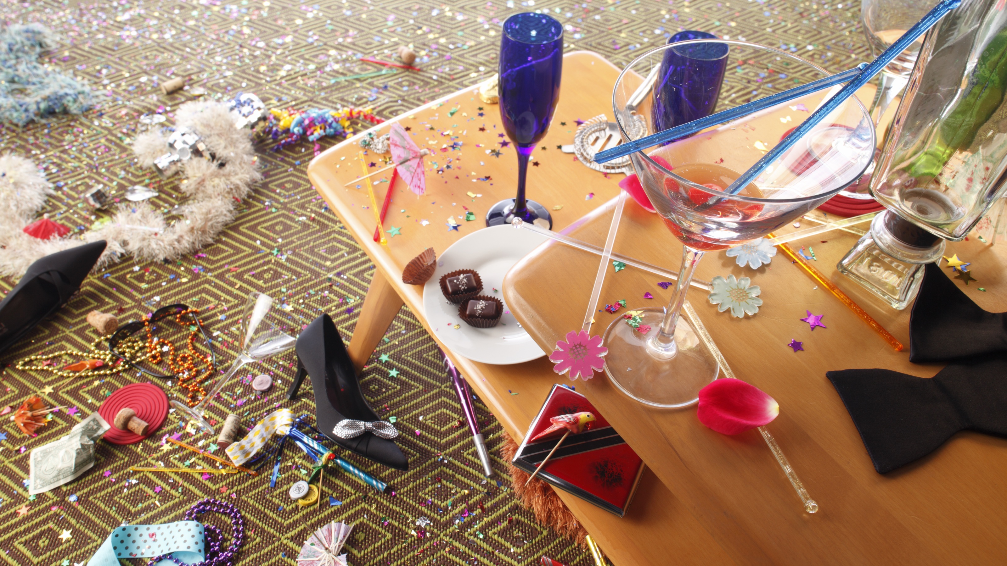 Champagne glasses, noisemakers and other celebratory debris after a big party.