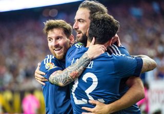 Gonzalo Higuain celebrates with Lionel Messi and Ezequiel Lavezzi after scoring for Argentina against the United States in the semi-finals of the Copa America Centenario in June 2016.