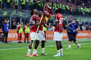 Rafael Leao, Youssouf Fofana and Tammy Abraham of AC Milan celebrate winning the match against FC Internazionale during the Serie A match between FC Internazionale and AC Milan at Stadio Giuseppe Meazza on September 22, 2024 in Milan, Italy.