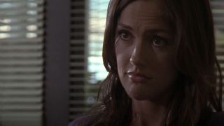 Minka Kelly as Lyla sitting in Tami's office looking disappointed in Friday Night Lights