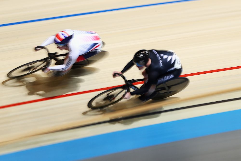 Jack Carlin of Great Britain and Zac Williams (black) of New Zealand compete in the Men's Sprint 1/16 Finals