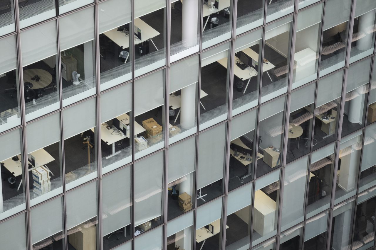 A photo peering inside the windows of an empty office building