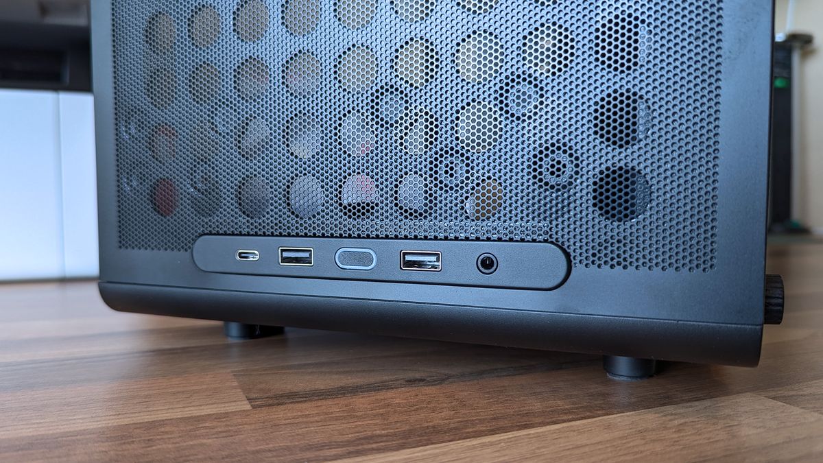 Cooler Master Qube 340 PC case front I/O panel showing USB-C, USB-A, and headphone port with power button