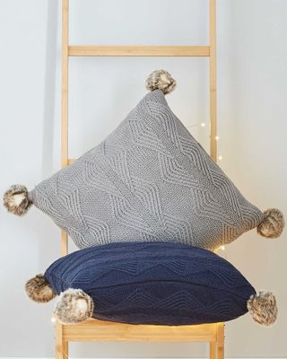 Knitted pom pom cushions from Aldi