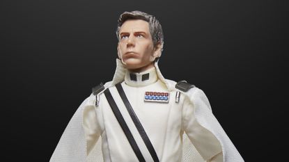 The Director Krennic Star Wars action figure looks off into the middle-distance against a black background