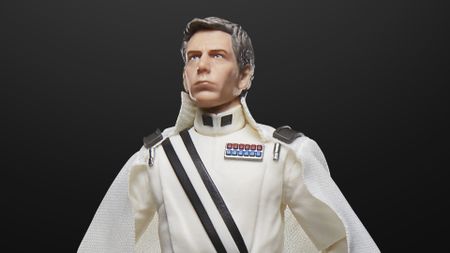 The Director Krennic Star Wars action figure looks off into the middle-distance against a black background