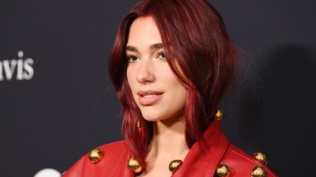 Dua Lipa shows off her red hair.