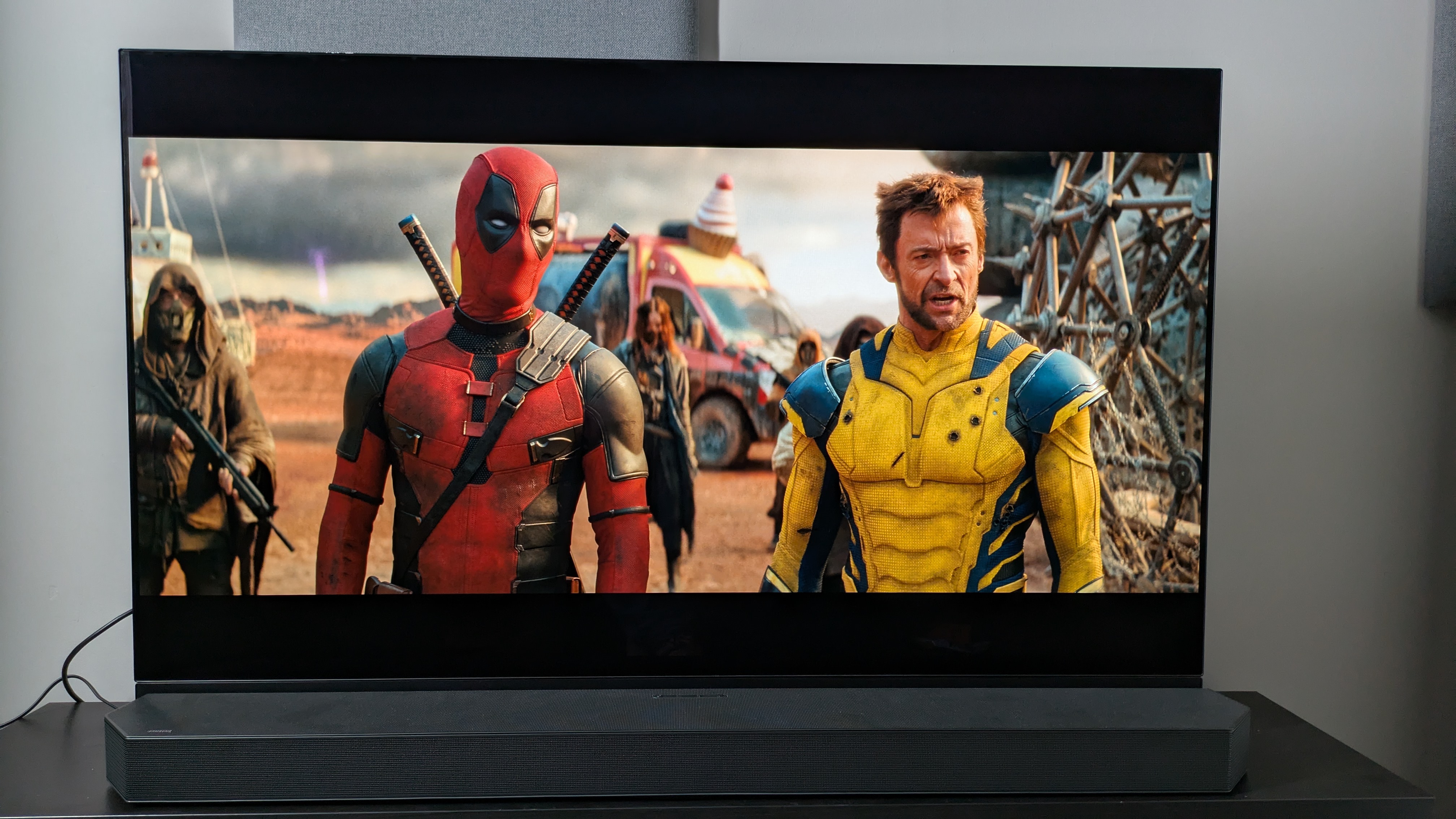 Deadpool & Wolverine on Panasonic MZ1500 with Samsung HW-Q990C soundbar in front of TV