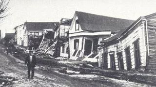 Black and white photo of wrecked houses in Valdivia, Chile after the 1960 earthquake.