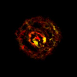 This image from ALMA shows the distribution of molecular gas close to the supermassive black hole at the centre of the galaxy NGC 1433. Image released Oct. 16, 2013.