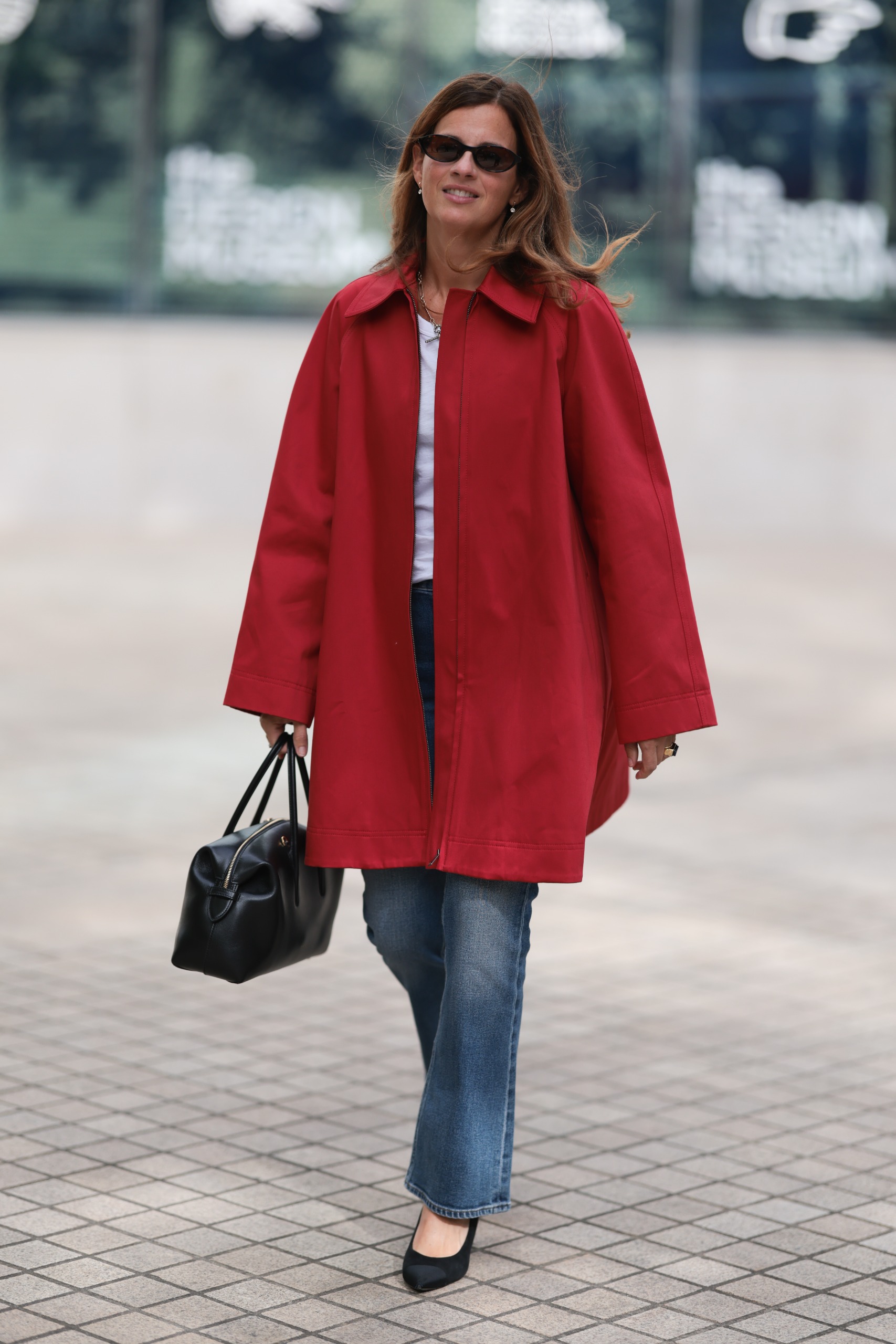 A guest wore a red coat similar to Zo&amp;euml; Kravitz's at London Fashion Week