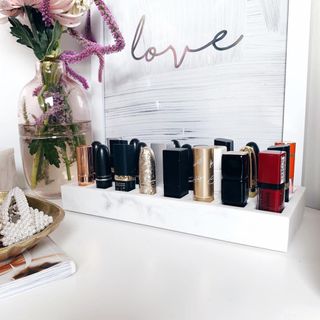 Lipstick and nail varnish tray displaying assorted collection