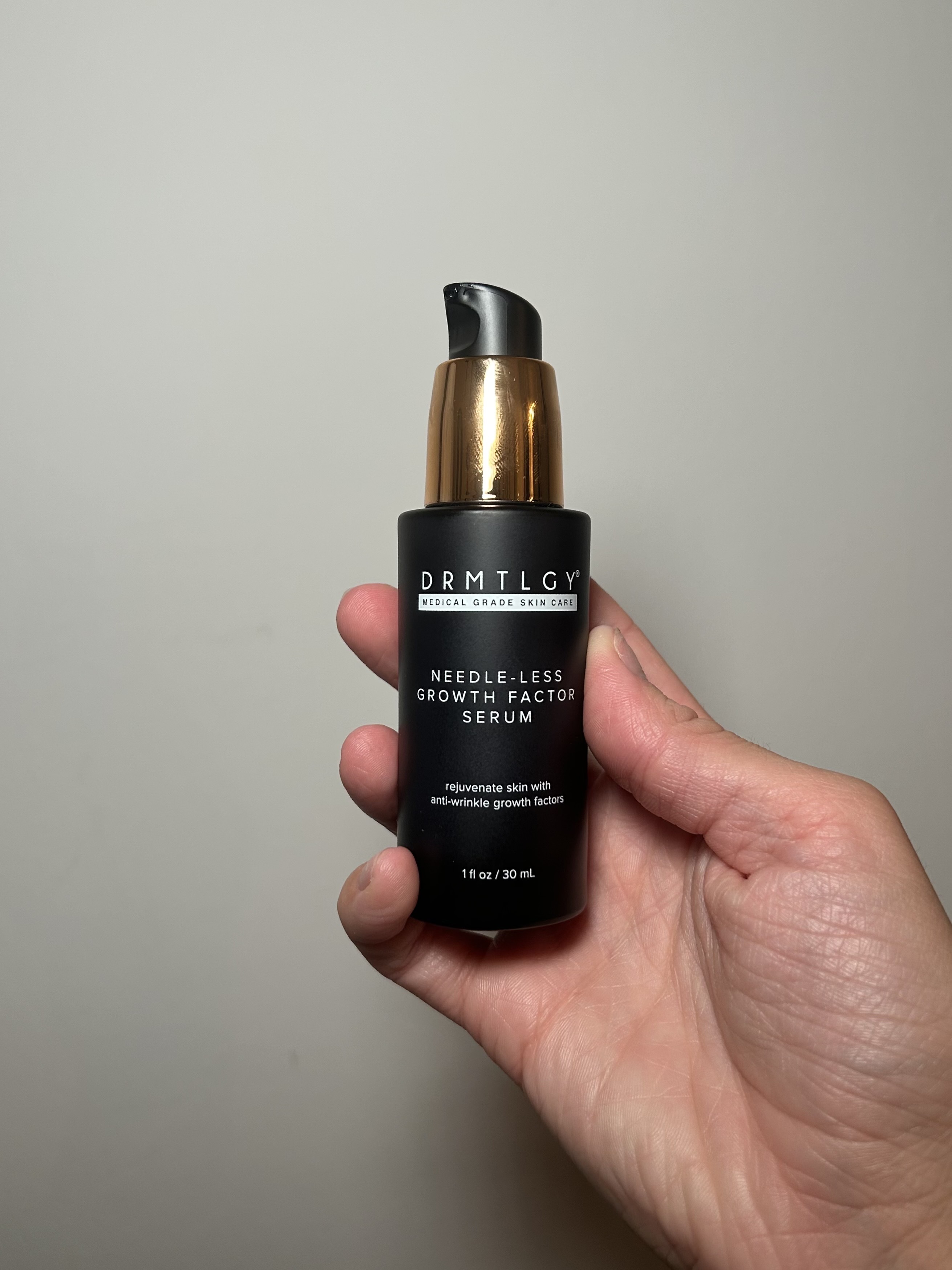 Alyssa Brascia holding the Drmtlgy Needle-less Growth Factor Serum.