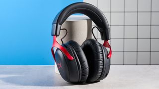 A black and red HyperX Cloud III S Wireless gaming headset