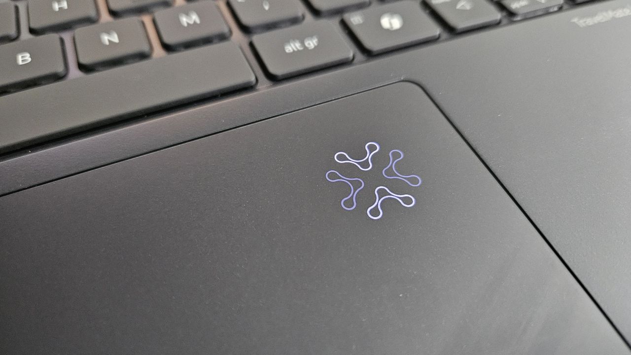 The Acer TravelMate P6 14 AI on a desk