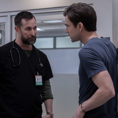 noah wyle as dr. robby having a conversation with patrick ball as langdon in tthe hospital hallway in the pitt season 2 finale 