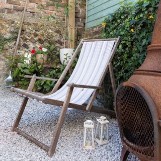 Garden deck chair, gravel surface, outdoors furnace heater
