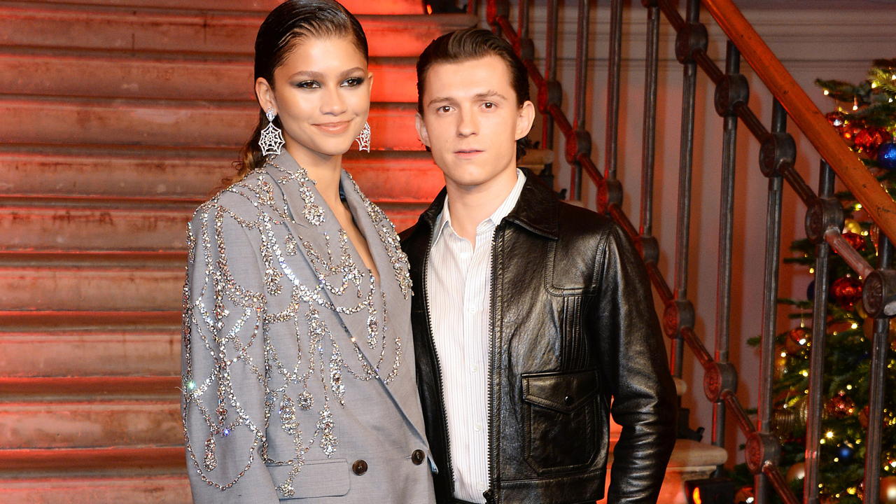 Zendaya and Tom Holland pose at a photocall for &quot;Spider-Man: No Way Home&quot; at The Old Sessions House on December 5, 2021 in London, England.