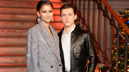 Zendaya and Tom Holland pose at a photocall for "Spider-Man: No Way Home" at The Old Sessions House on December 5, 2021 in London, England.