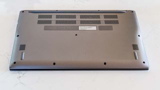 Acer Chromebook 515 flipped over on desk, showing underside