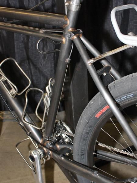 The rear end bolts on with just a pair of large bolts - one up at the seat cluster and the other down by the bottom bracket shell.