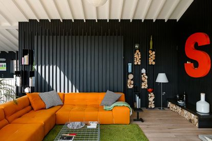Modern house with open plan layout and black painted walls