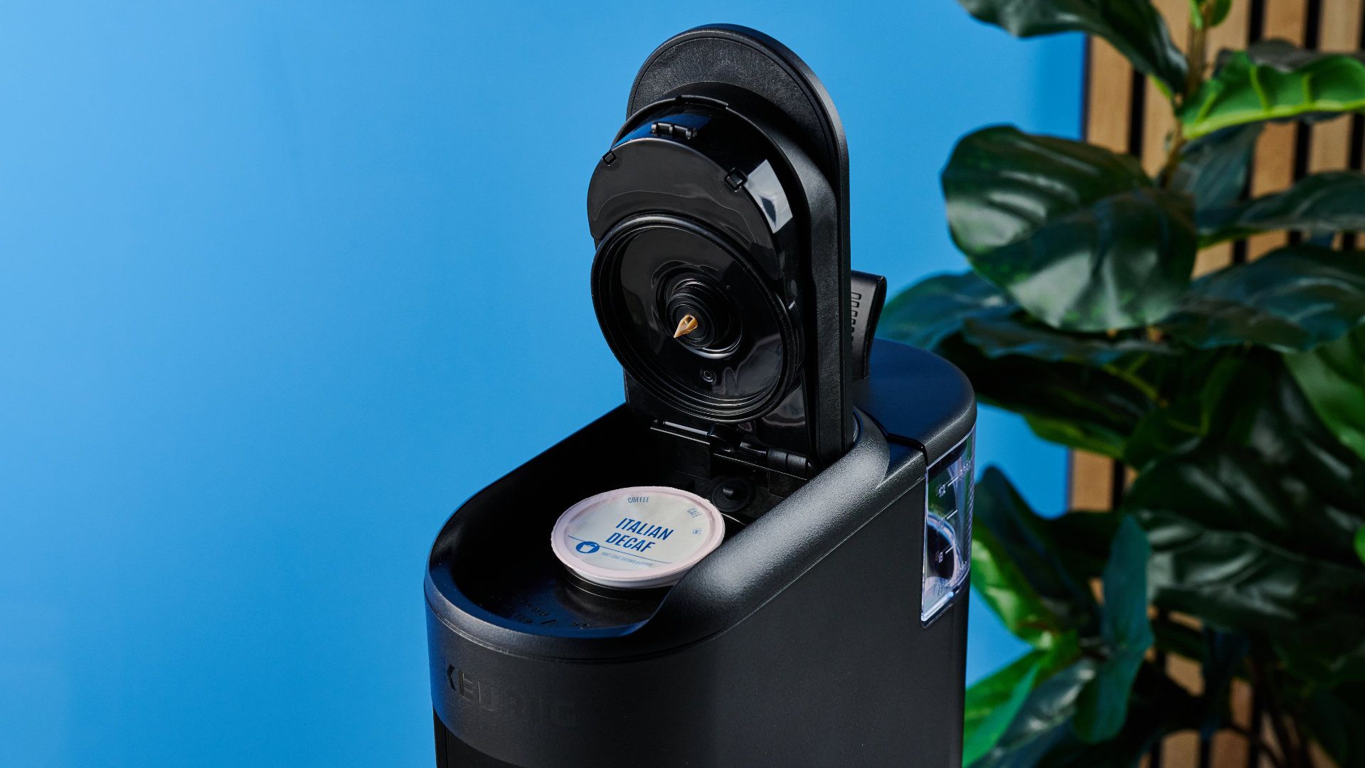 the keurig k-mini mate coffee maker photographed with the blue tom's guide background