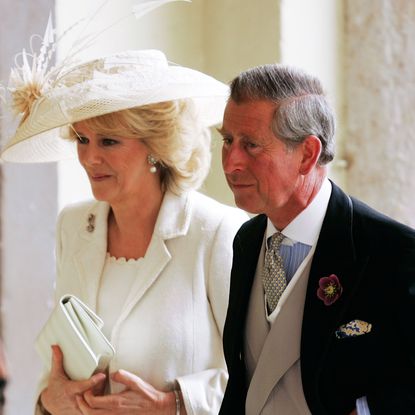 Queen Camilla wears off-white and pale green on her wedding day, including a white hat, to marry King Charles in 2005