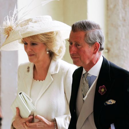 Queen Camilla wears off-white and pale green on her wedding day, including a white hat, to marry King Charles in 2005