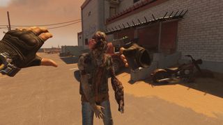 A player points a gun at a zombie in a first-person VR perspective