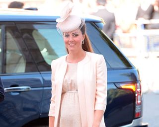 Kate Middleton and baby bump wearing Jenny Packham at Queen's Coronation Service