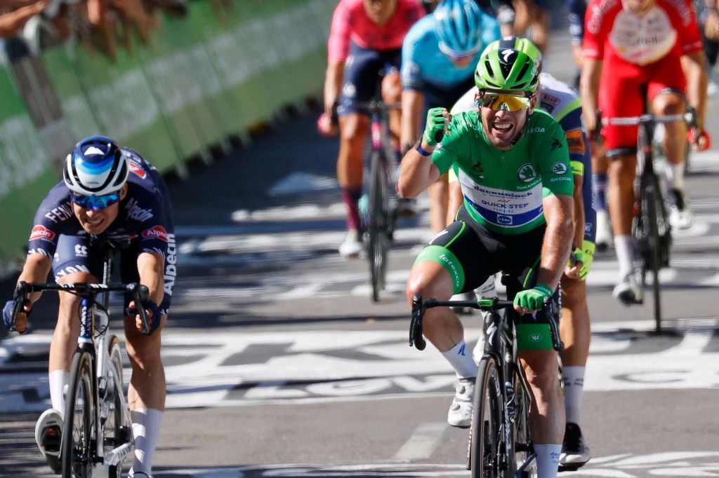 Stage winner Team Deceuninck Quicksteps Mark Cavendish of Great Britain wearing the best sprinters green jersey crosses the finish line at the end of the 13th stage of the 108th edition of the Tour de France cycling race 219 km between Nimes and Carcassonne on July 9 2021 Photo by Thomas SAMSON AFP Photo by THOMAS SAMSONAFP via Getty Images