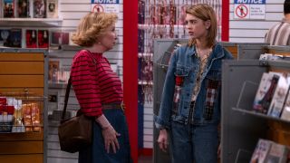 Debra Jo Rupp and Callie Haverda talk in front of the adult video section's curtain in That '90s Show.