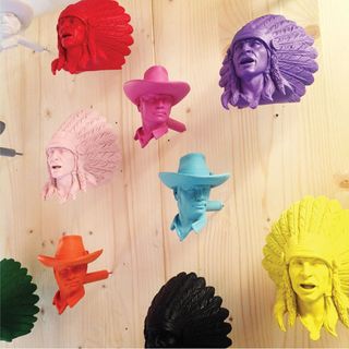 cowboy and indian shaped brightly coloured wall hooks