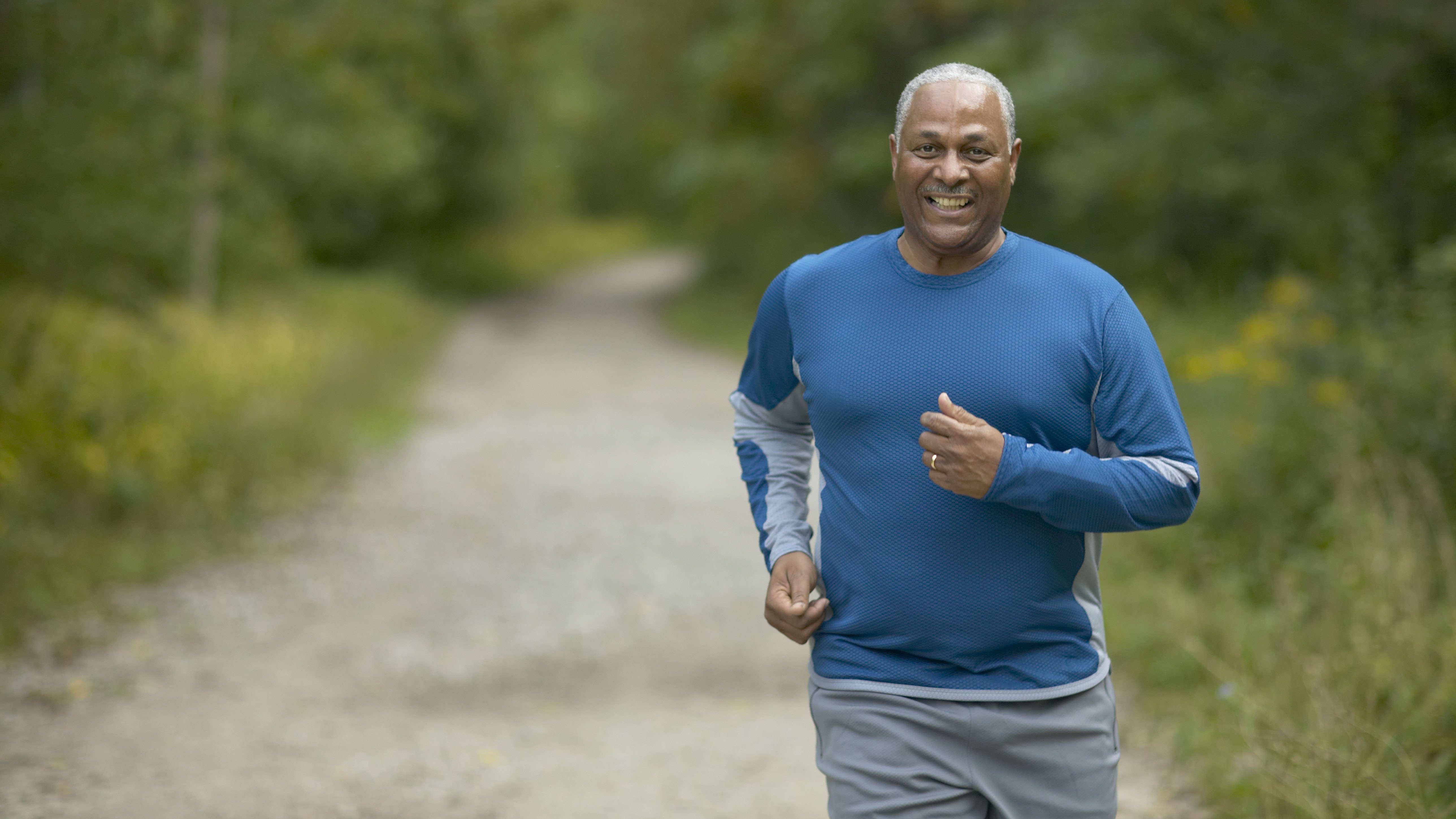 Older man running in rural location