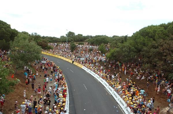Hundreds of fans line the finish on Bastille Day
