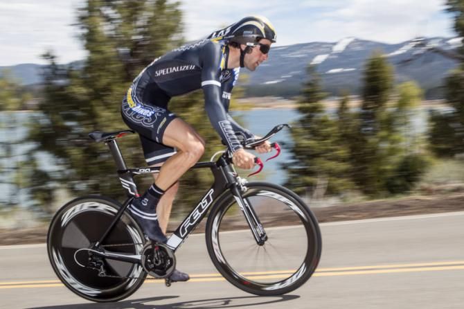 Roman Kilun (Mike's Bikes) out of the saddle on the climb.