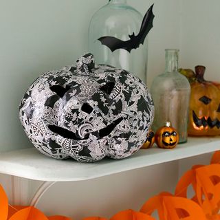 room with white walls glass bottle and pumpkin shaped containers